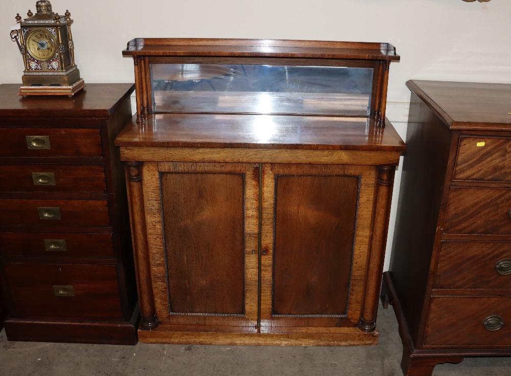 A 19th Century rosewood chiffonier, having raised mirrored gallery back, shelves below enclosed by a