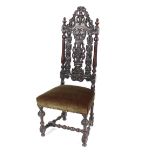 An antique carved oak hall or side chair, with pierced foliate decoration flanked by turned columns,