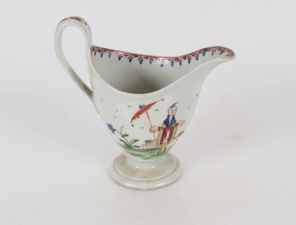 A Newhall porcelain cream jug of helmet shape, decorated with Chinese figures on circular spread - Image 2 of 3