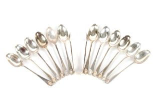 A set of twelve late Victorian silver teaspoons with shell decorated terminals, London 1894; and a