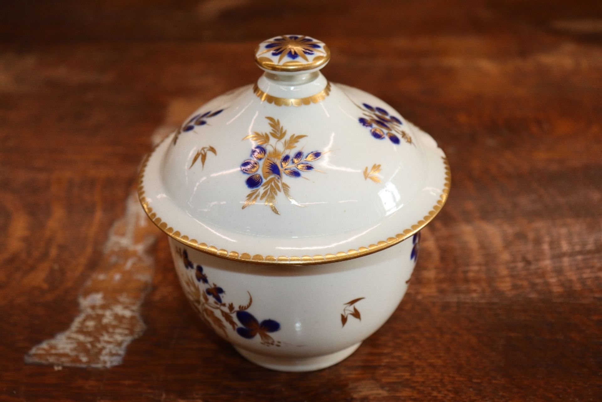 A 19th Century English porcelain part tea set having blue floral decoration heightened in gilt, - Image 12 of 33