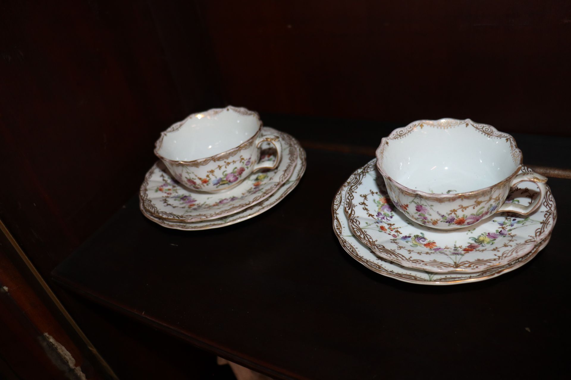 A Meissen part tea set, having painted foliate sprays heightened in gilt within shaped borders, - Image 6 of 9
