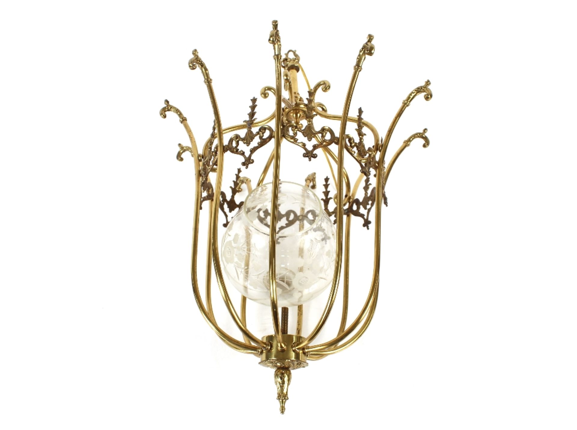 A decorative brass hanging lamp, having raised foliate and scroll decoration, 55cm overall