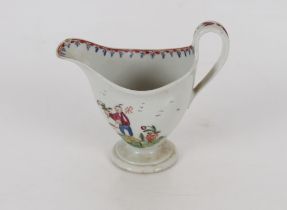 A Newhall porcelain cream jug of helmet shape, decorated with Chinese figures on circular spread