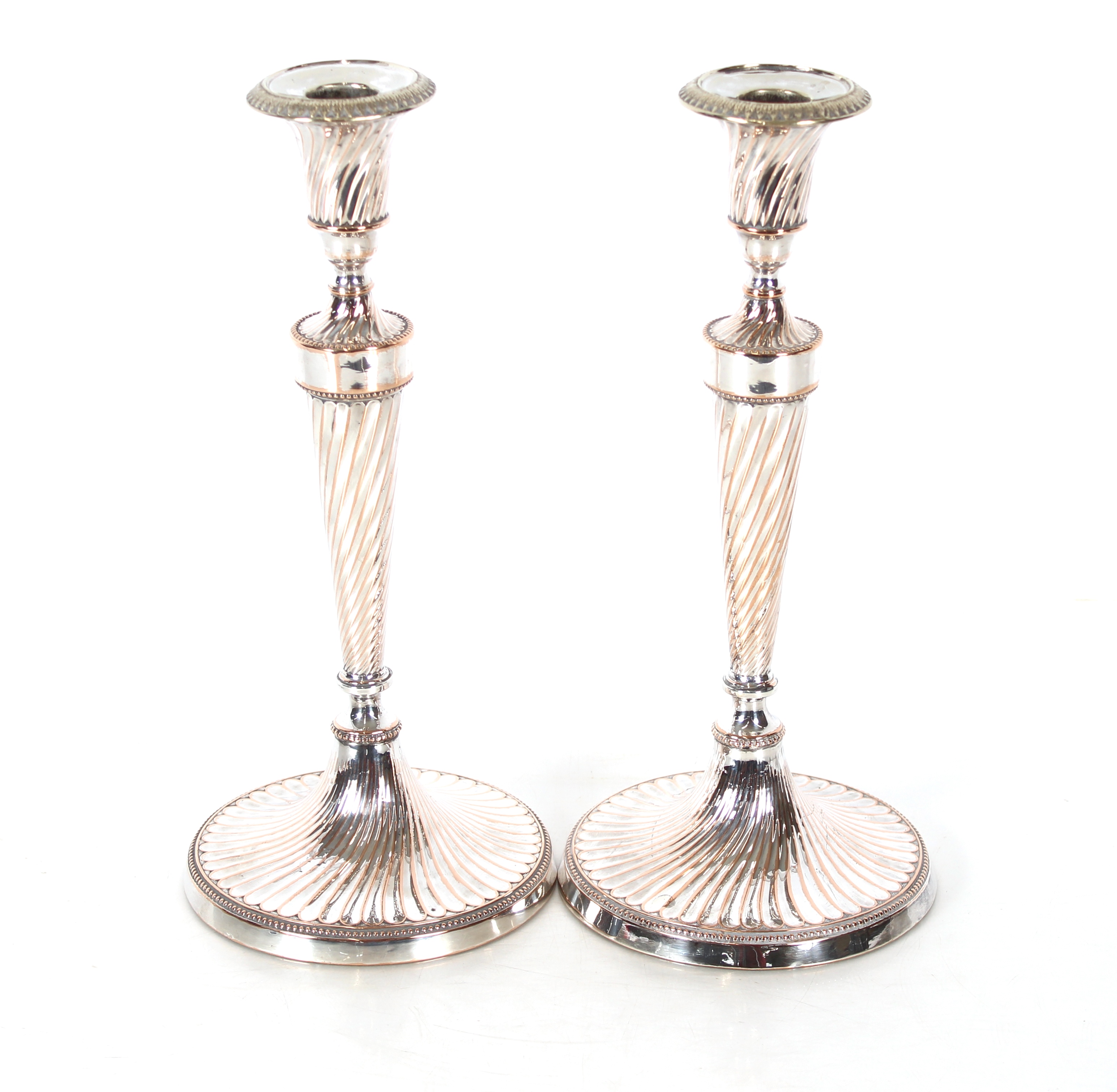 A pair of plate on copper candlesticks, Campana sh