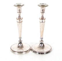 A pair of plate on copper candlesticks, Campana sh