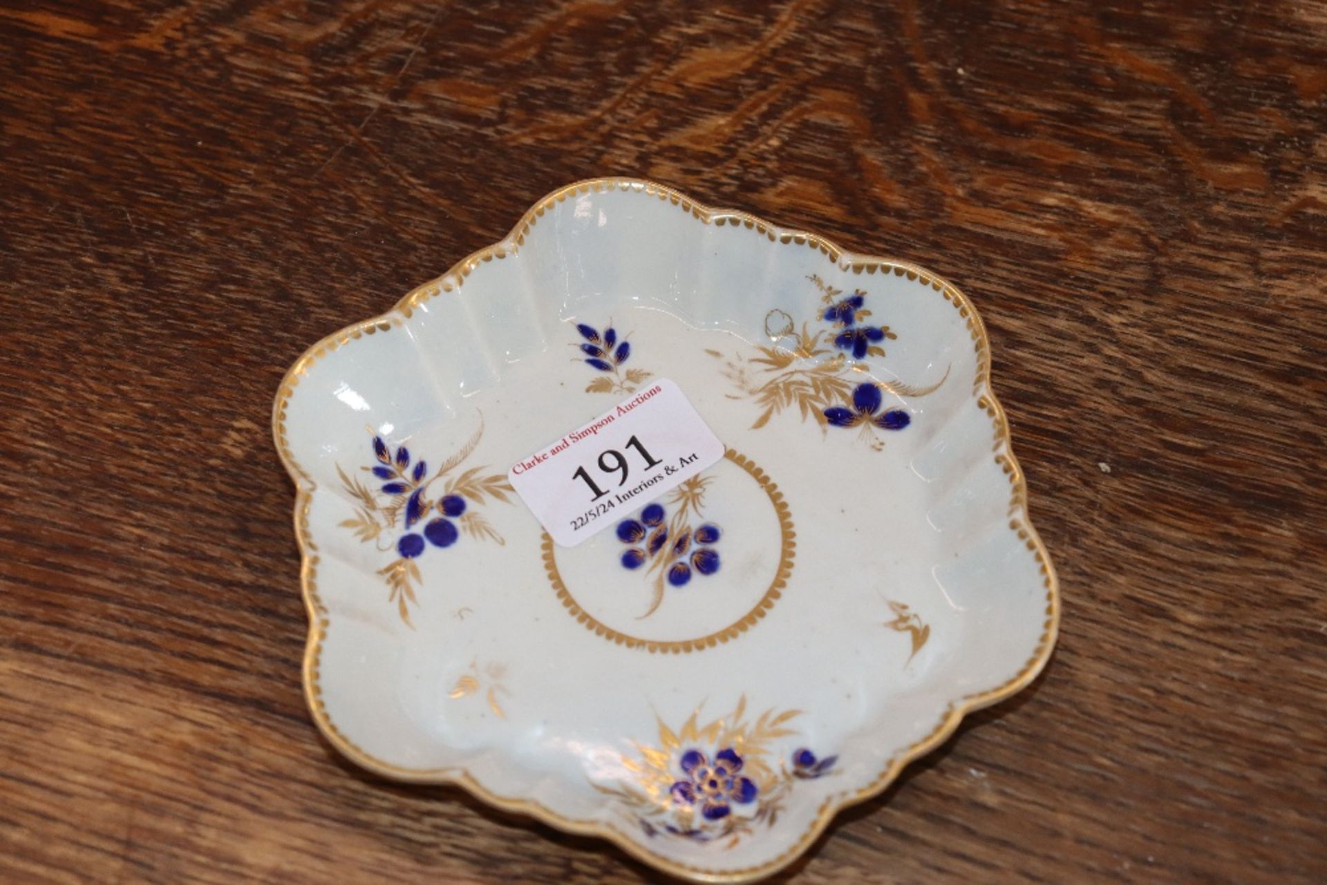 A 19th Century English porcelain part tea set having blue floral decoration heightened in gilt, - Image 2 of 33