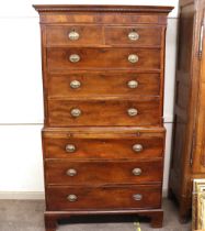 A George III mahogany chest on chest, the upper section fitted two short and three long drawers