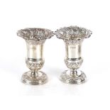 A pair of Edwardian silver urn shaped vases, Sheffield 1901, 13cm high