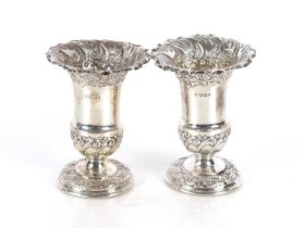 A pair of Edwardian silver urn shaped vases, Sheffield 1901, 13cm high