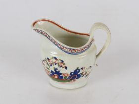 A Newhall porcelain cream jug, decorated in the fence pattern, 11cm high