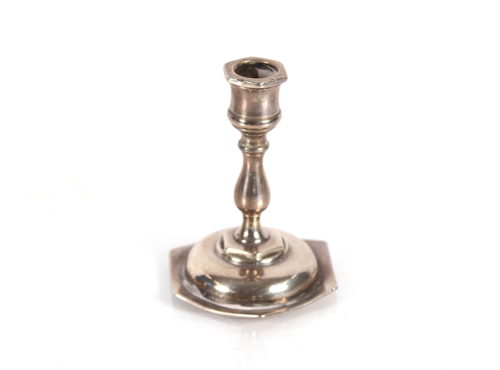 A miniature silver candlestick Birmingham 1897; an Edwardian silver teaspoon in the form of an