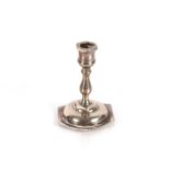 A miniature silver candlestick Birmingham 1897; an Edwardian silver teaspoon in the form of an