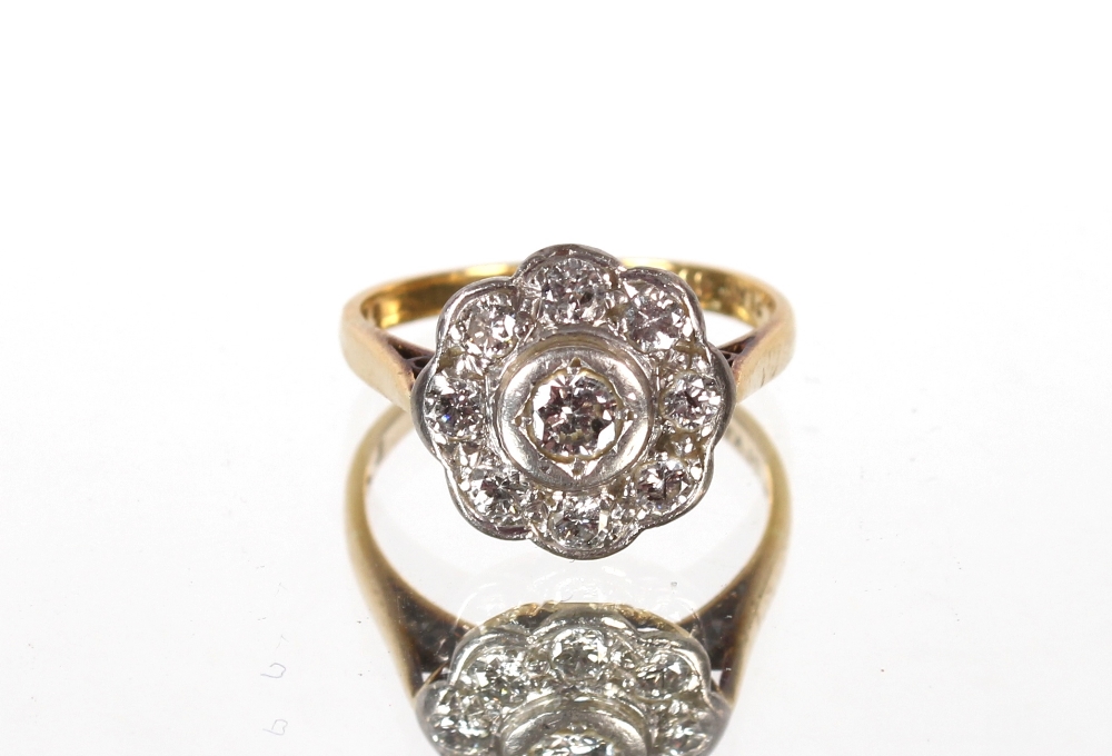 A Victorian diamond daisy shaped cluster ring, 18ct gold, 3.4gms, ring size L
