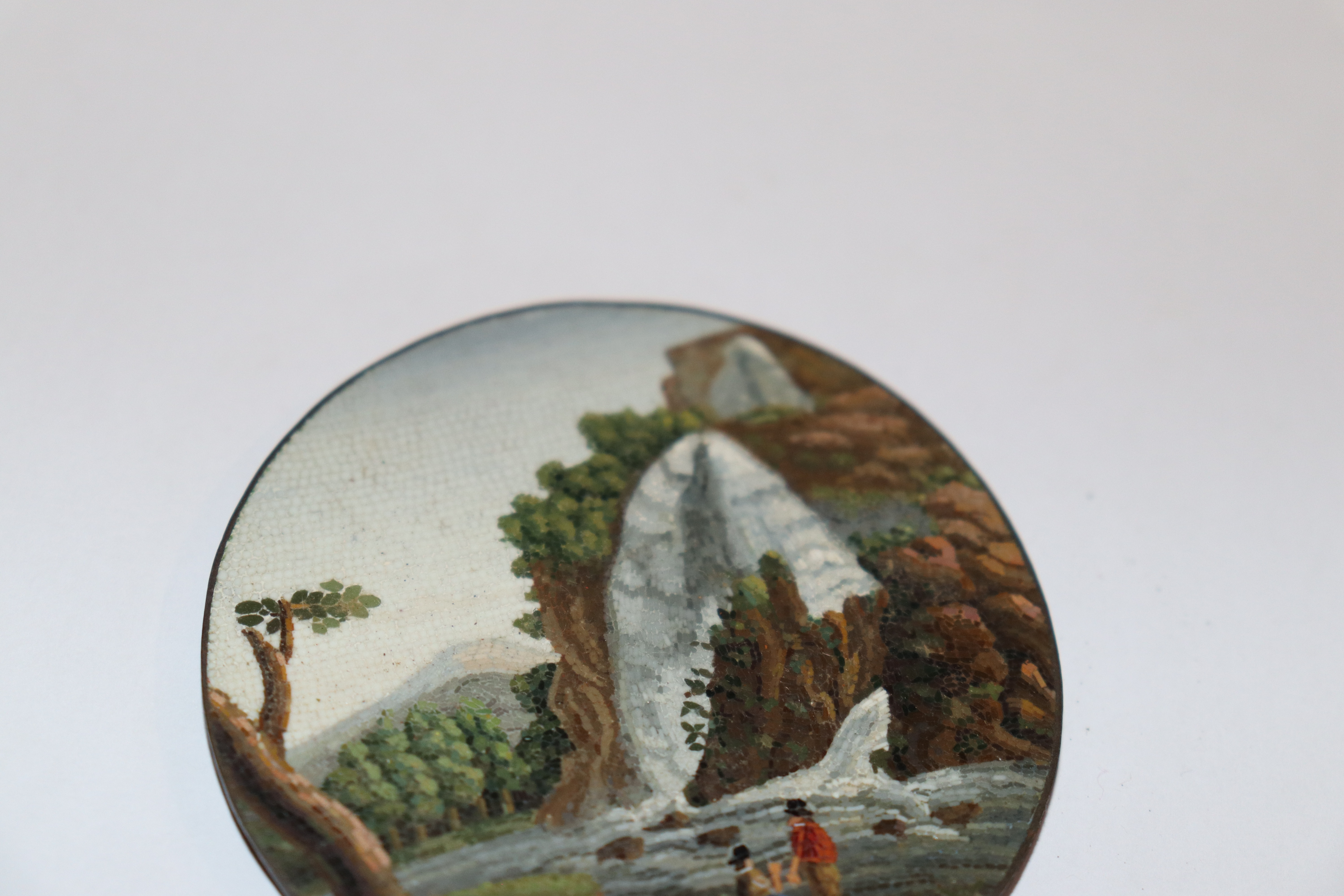 A miniature circular micro mosaic picture depicting figures in front of a waterfall; and a pair of - Image 8 of 11