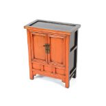 A Chinese lacquered and painted side cabinet, enclosed by a pair of panel doors, 55cm wide x 30cm
