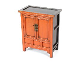 A Chinese lacquered and painted side cabinet, enclosed by a pair of panel doors, 55cm wide x 30cm