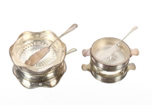 A glass and silver mounted butter dish; a smaller similar and two silver butter knives