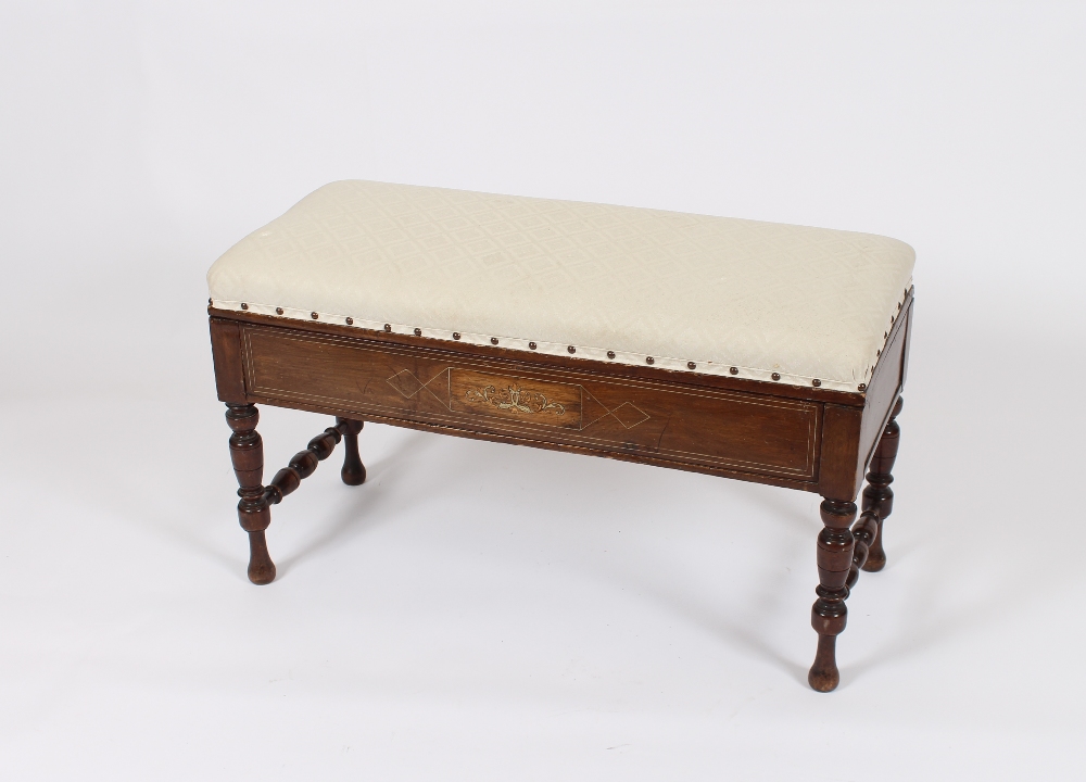 An Edwardian inlaid duet stool, having upholstered lifting seat raised on turned baluster supports