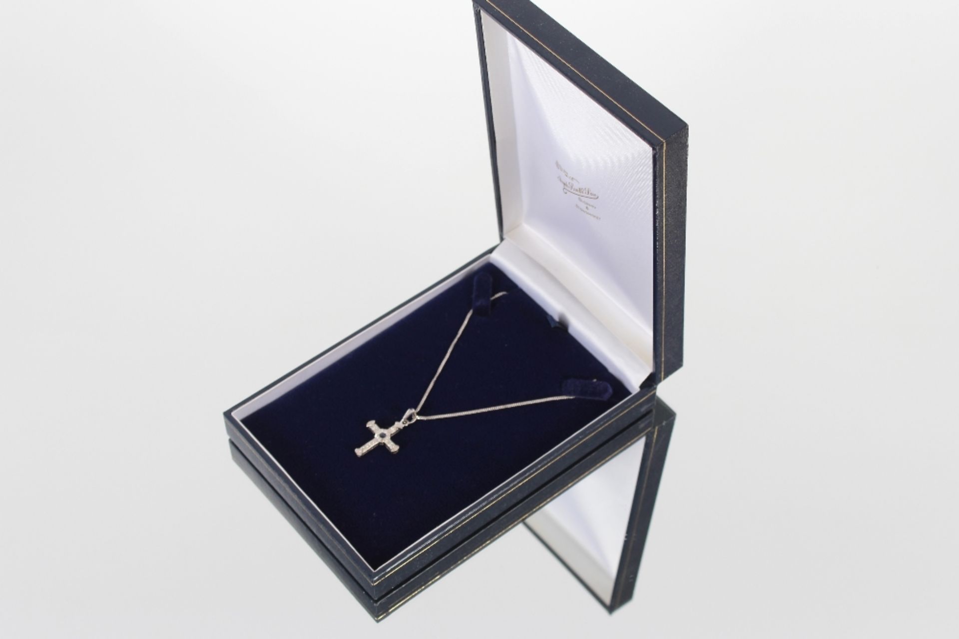 An 18ct white gold diamond and sapphire set cross and fine link chain, 6.6gms - Image 2 of 5
