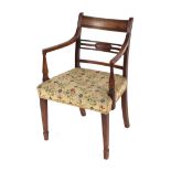 A 19th Century mahogany rail bac k elbow chair with tapestry seat