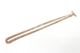 A 9ct gold graduated curb link chain with T bar, 28" (71cms), 39.5gms
