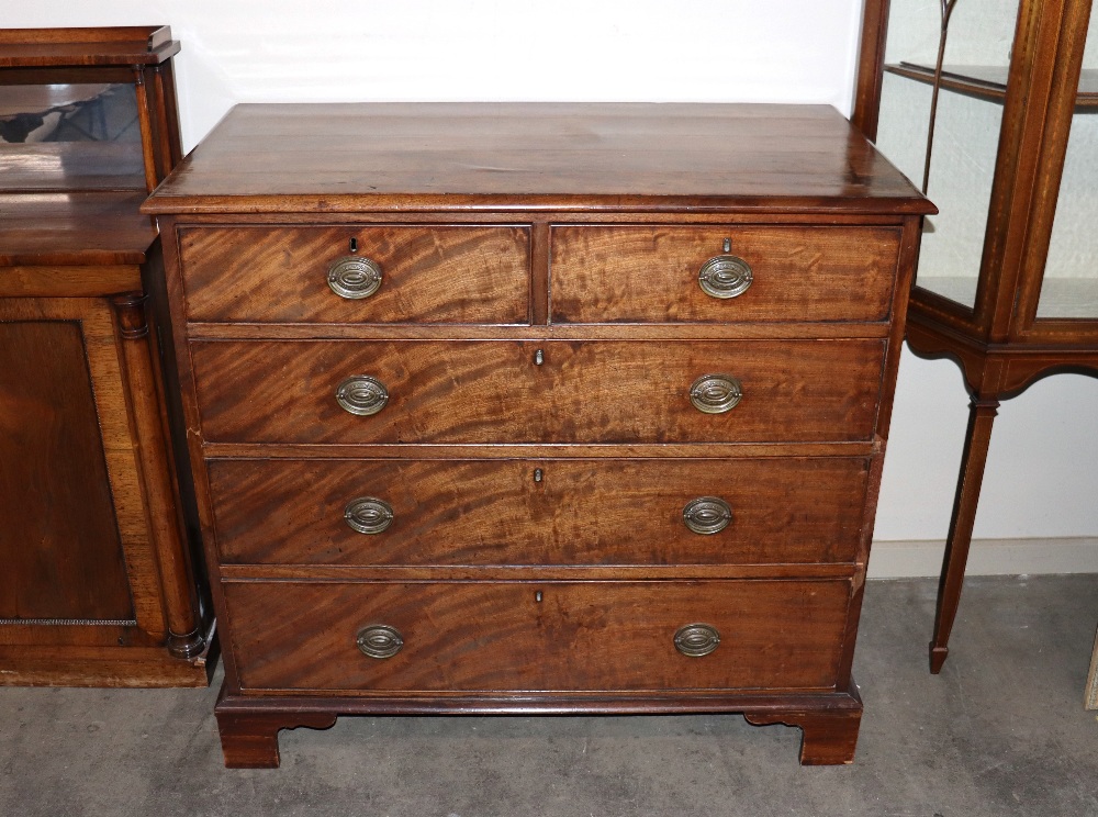 A 19th Century mahogany chest fitted two short and three long graduated drawers, raised on bracket