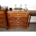 A 19th Century continental walnut chest, fitted four long graduated drawers with brass foliate