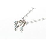 A 9ct white gold and aquamarine set necklace, 3.3gms