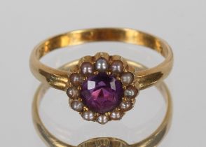 A seed pearl and amethyst set ring, 18ct gold mount, 2.5gms