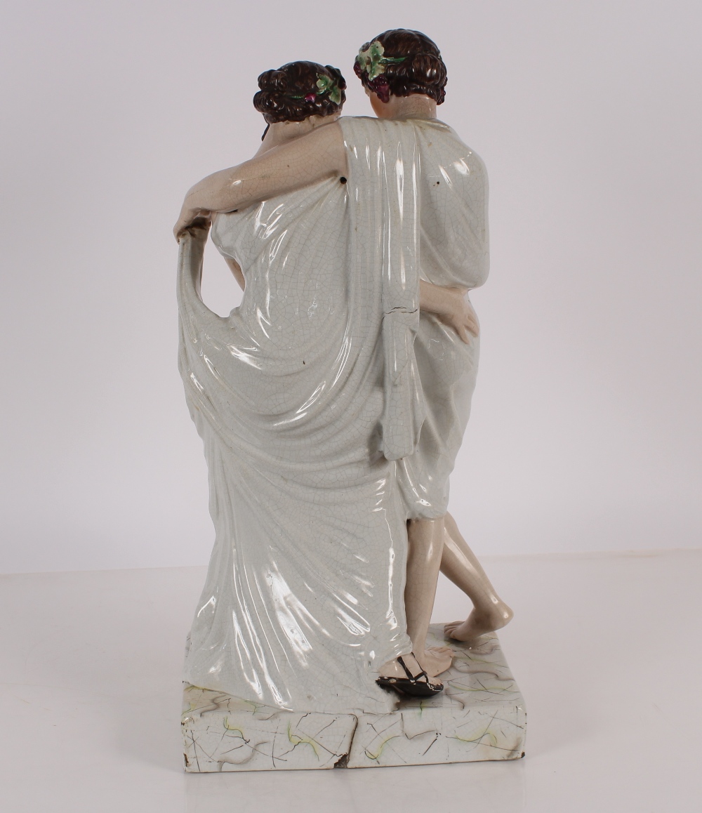 A large Staffordshire figure depicting a Bacchanalian couple, on plinth base, 64cm high - Bild 3 aus 4