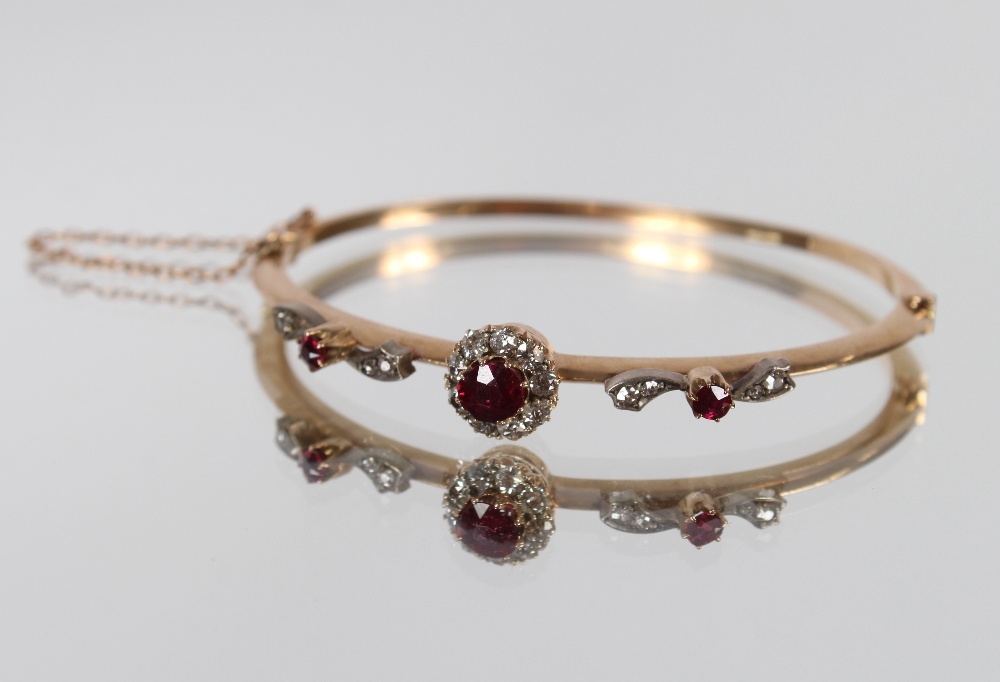 A yellow metal ruby and diamond set snap bangle, bar brooch and ring, having interchangeable and