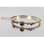 A yellow metal ruby and diamond set snap bangle, bar brooch and ring, having interchangeable and