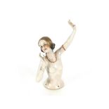 An Art Deco risqué porcelain pin doll, 18cm high