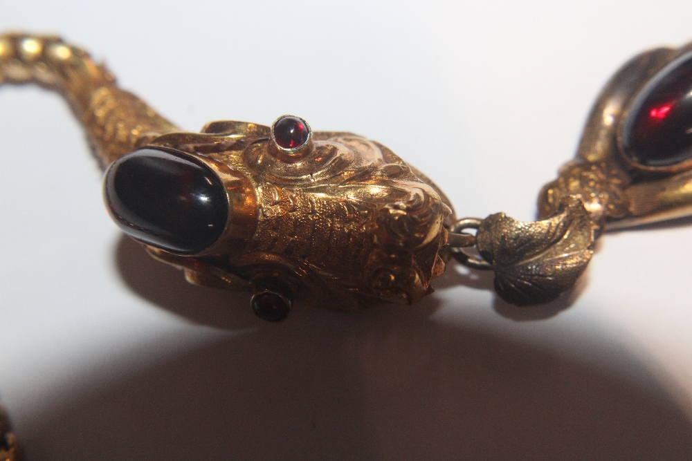 A Victorian yellow metal and garnet set serpent necklace, 18gms total weight, (tests as gold) in - Image 33 of 34