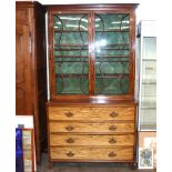 An early 19th Century mahogany secretaire bookcase, the upper adjustable shelves enclosed by a