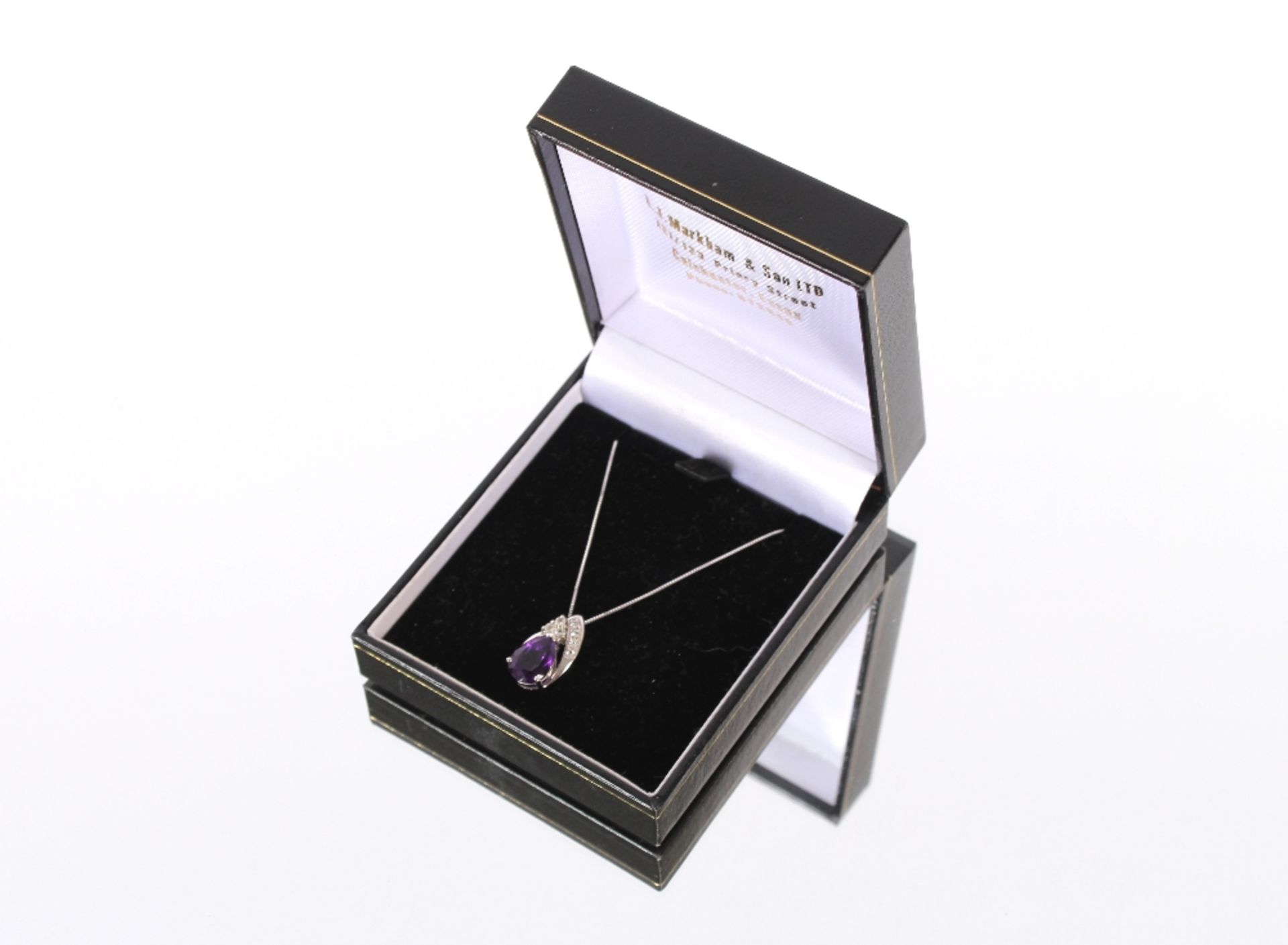 A 9ct white gold diamond and amethyst set necklace, hung to a fine link chain - Image 2 of 4