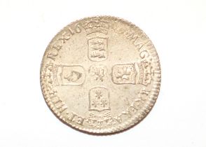 A William III sixpence (date worn)