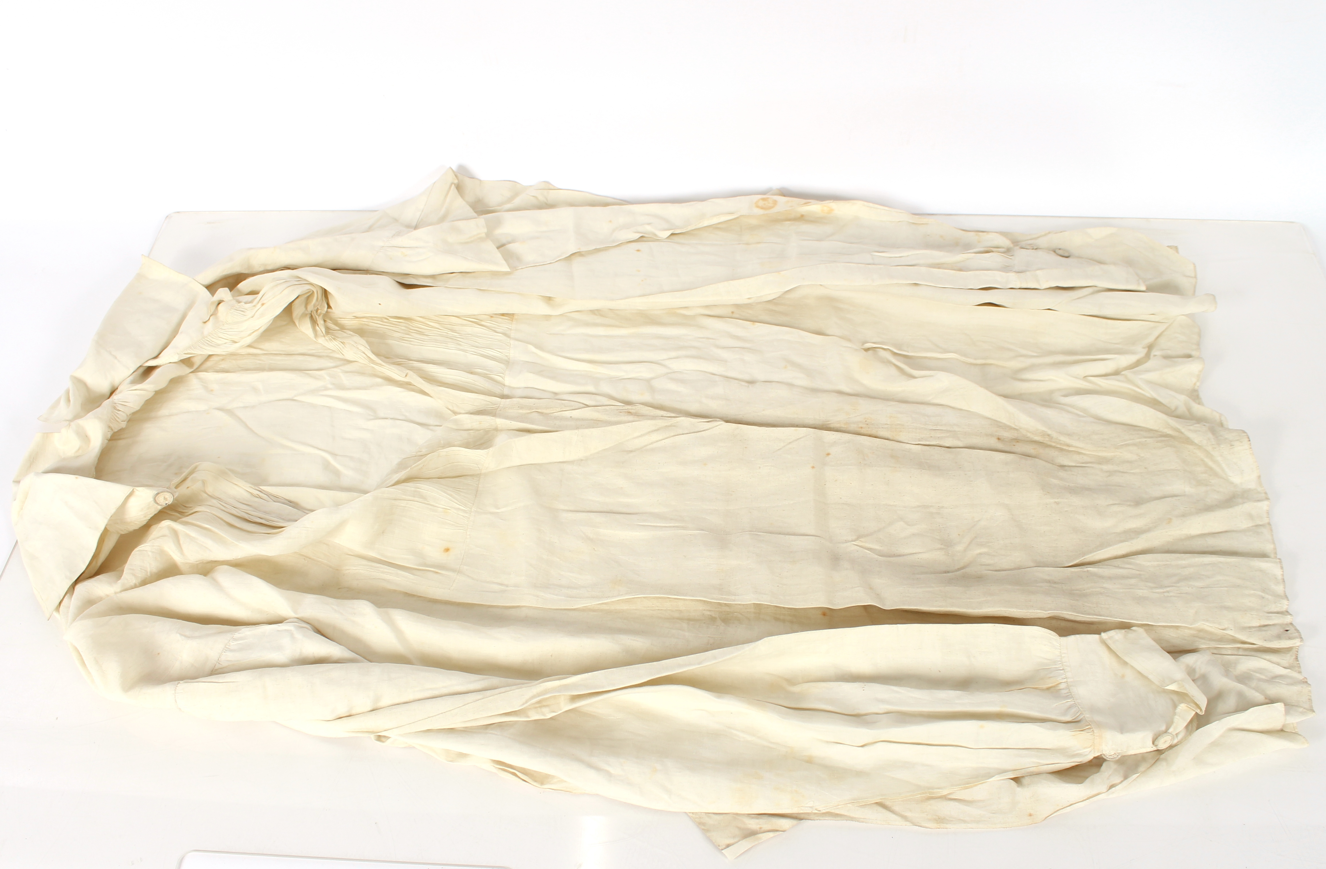 A linen shirt with attached label stating "A George IV shirt when Prince of Wales"; other lace