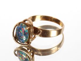 A 9ct gold opal set dress ring with pierced claw mount, 3.8gms