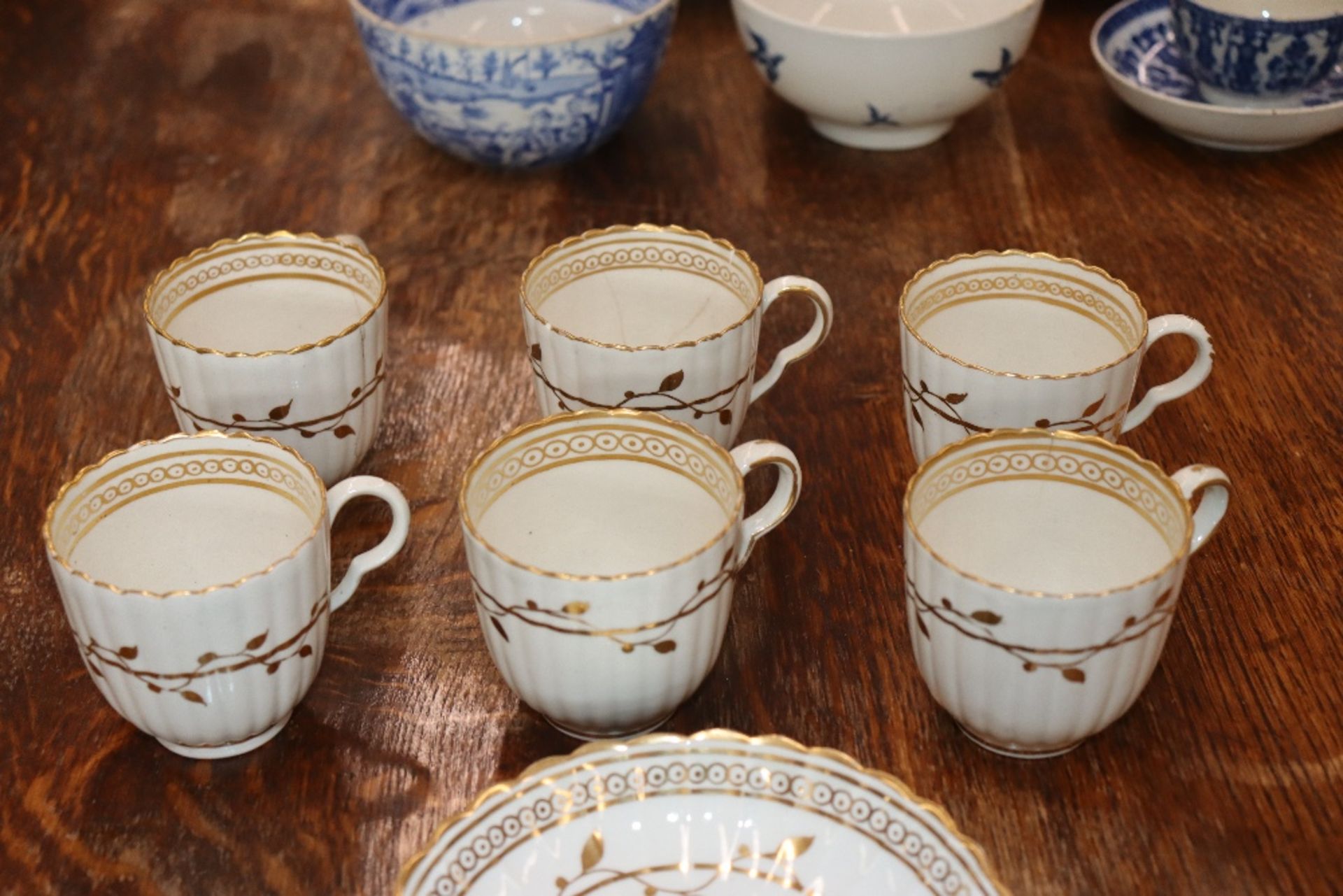 An early 19th Century English porcelain part tea set, of fluted design comprising numerous cups, - Image 22 of 32