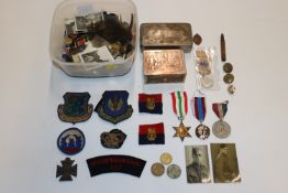 A tub of mixed badges etc