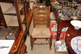 A set of five rush seated and ladder back chairs