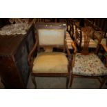 A 19th Century scroll elbow chair in need of resto