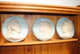 Three classical style plaster portrait plaques