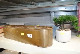 Two metal planters and an artificial Bonsai tree