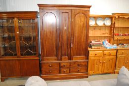 A Victorian mahogany combination wardrobe fitted h