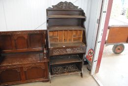 A Victorian carved oak student's bureau AF