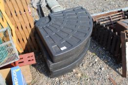 Four plastic parasol weights