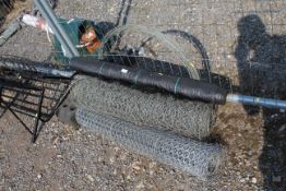 Two part rolls of chicken wire, a roll of wire met